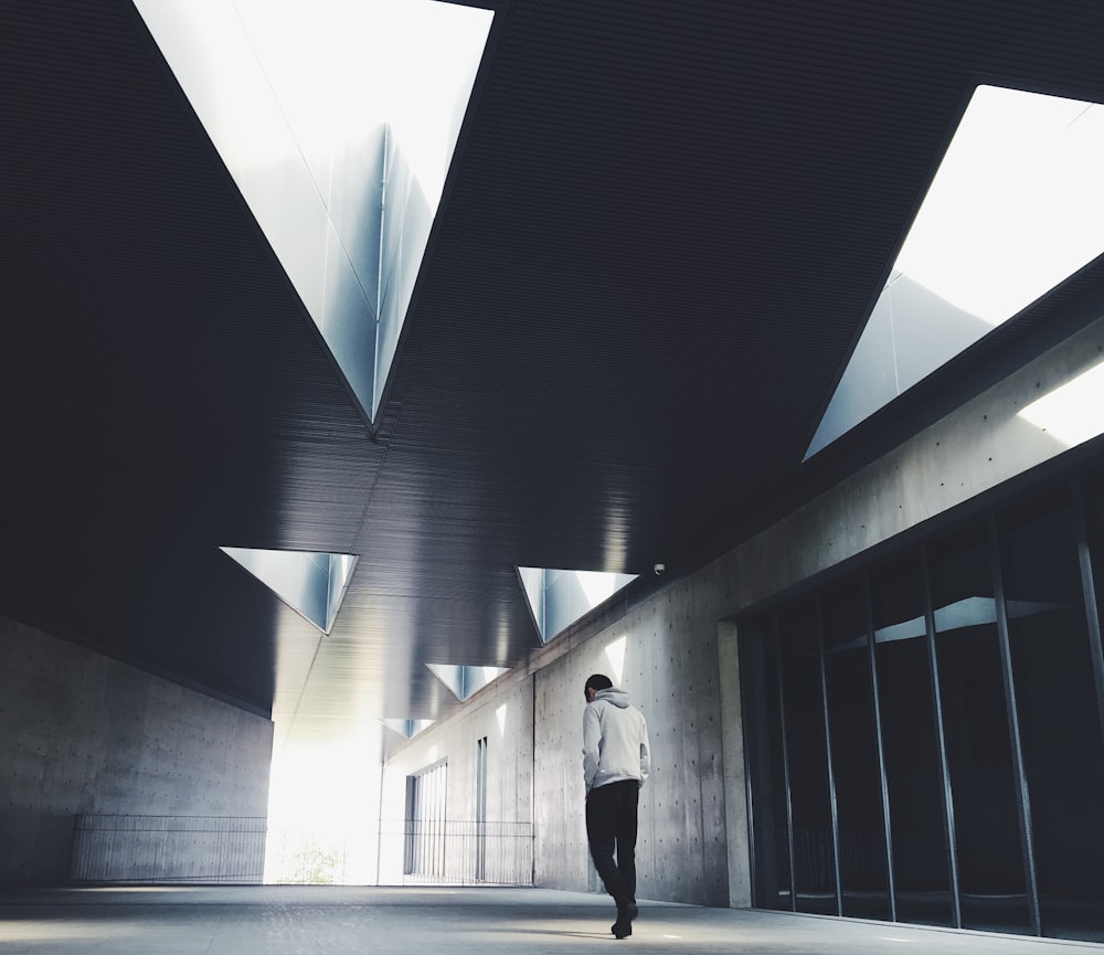 man standing inside black room