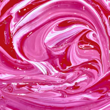 A vibrant swirl of pink and red hues blending seamlessly, evoking energy and warmth.