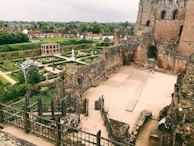 A picturesque view of ancient ruins in a lush green setting.