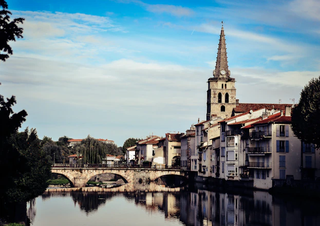 a river running through a city next to a bridge