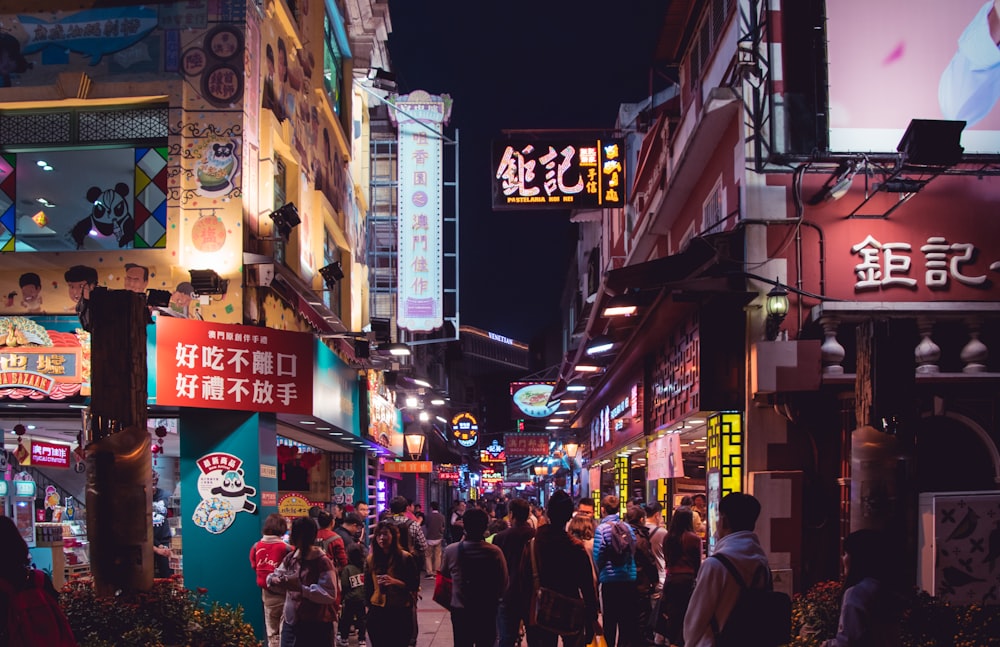 group of people at the street in between of buildings