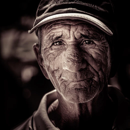 a black and white photo of a man with wrinkles