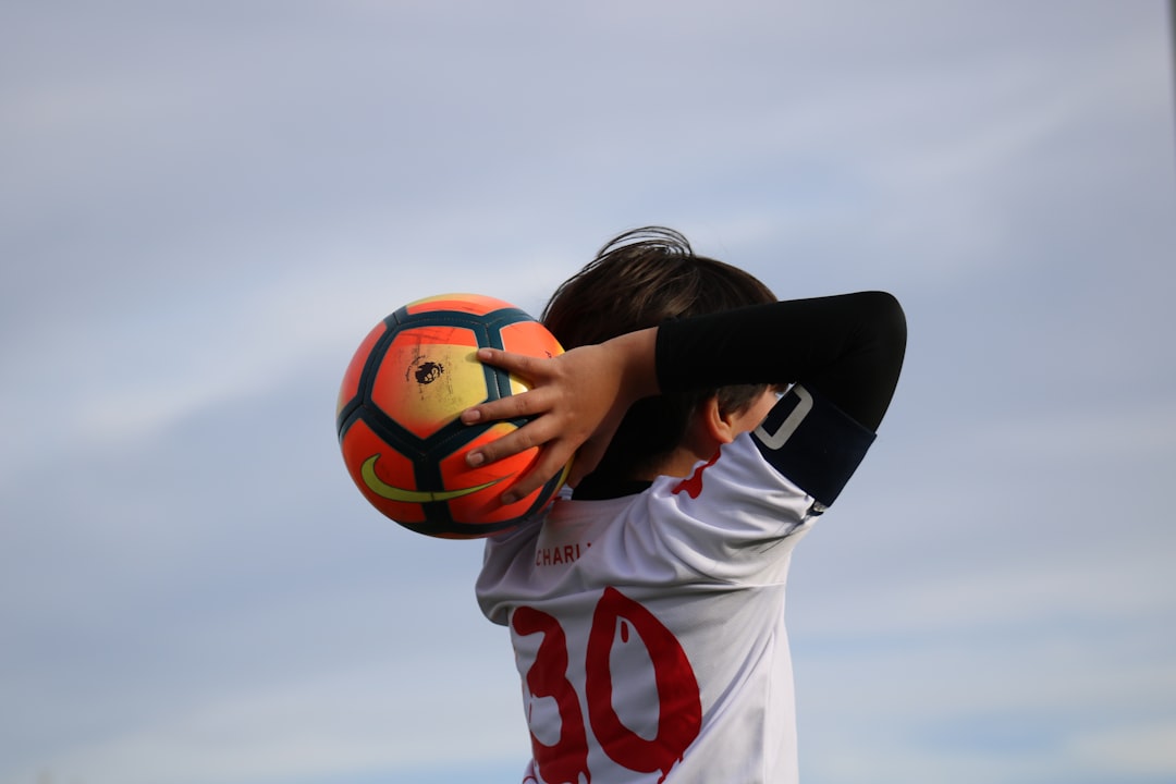 boy holding soccer ball