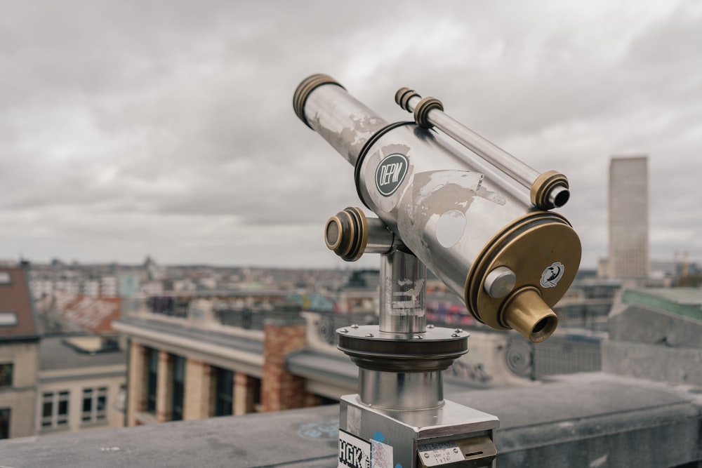 selective focus photo of gray and brown telescope