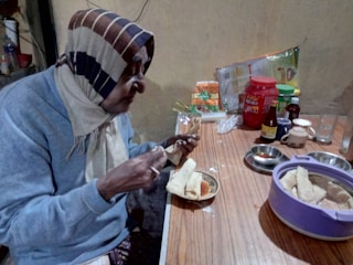 Help with meal preparation and feeding for elderly person.