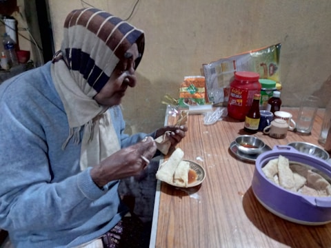 Help with meal preparation and feeding for elderly person.