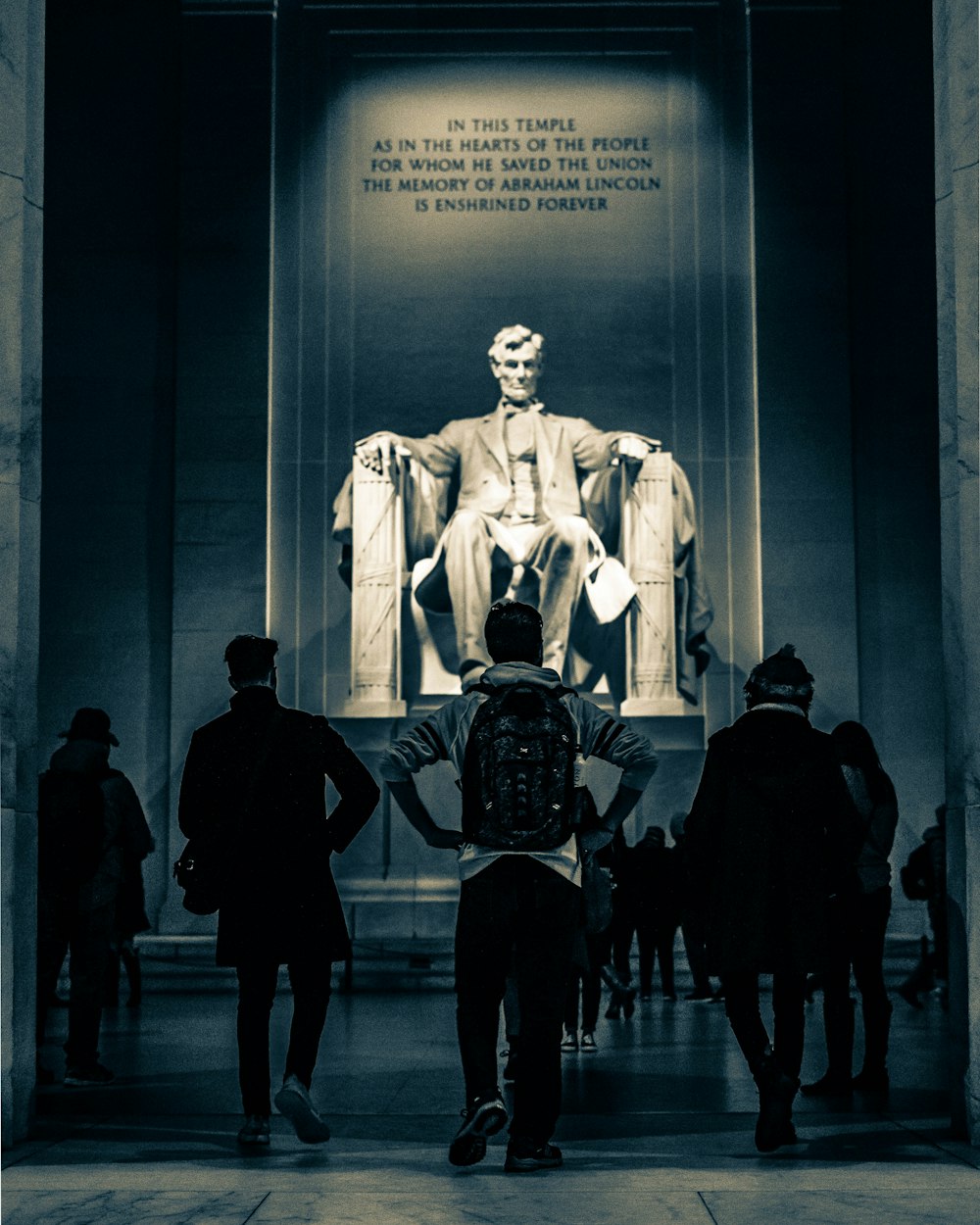 person walking near statue