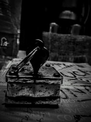 A sleek black and white photo of a notary stamp on official documents.