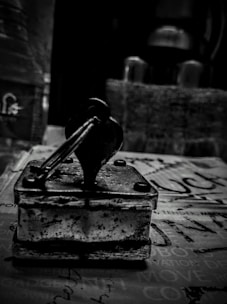 A sleek black and white photo of a notary stamp on official documents.