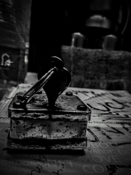 Close-up of a custom rubber stamp with intricate details on a wooden handle.