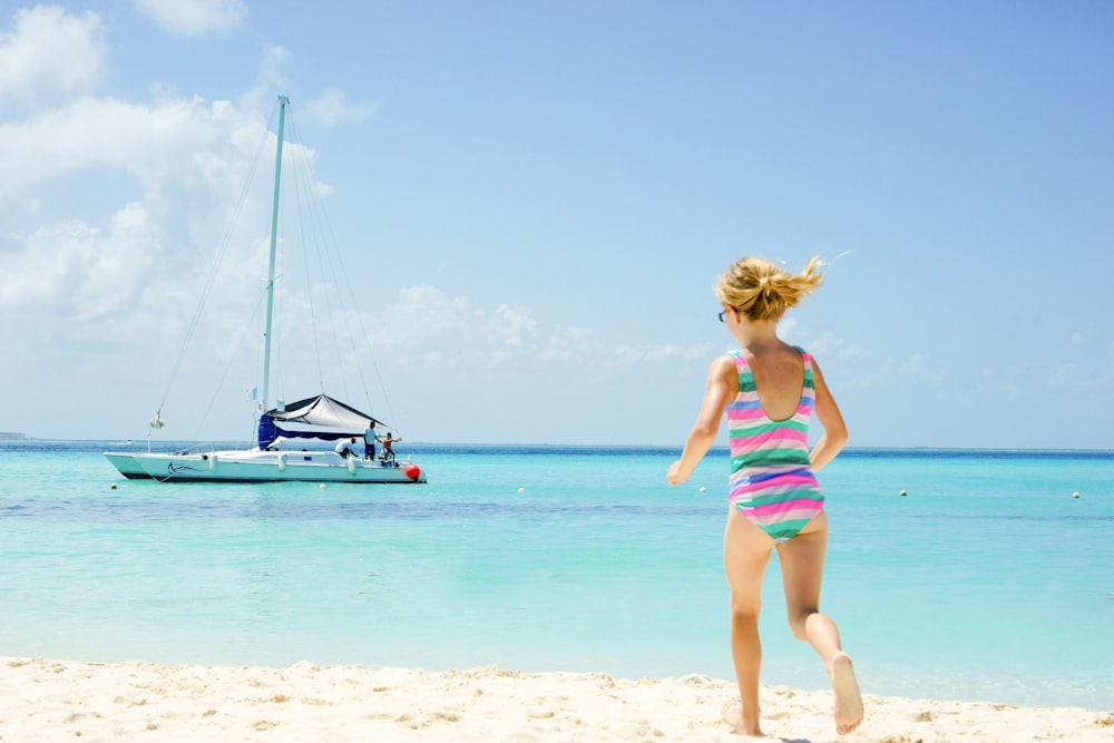 girl in monokini heading to sea