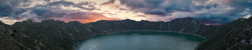 mountain around body of water