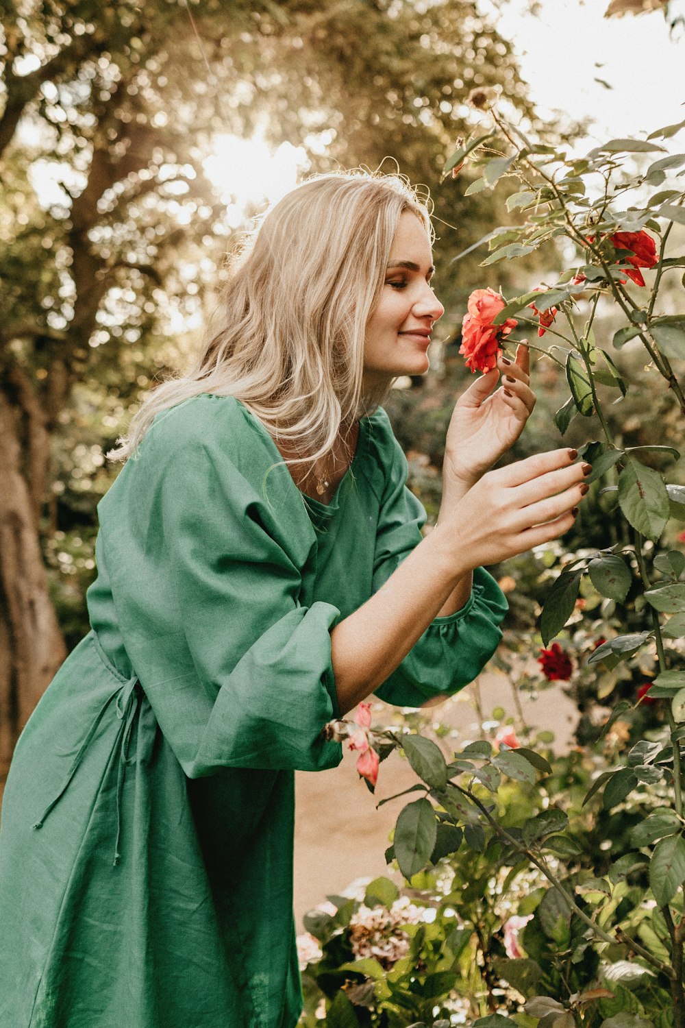 selective focus photo of woman wearing green long-sleeved dress