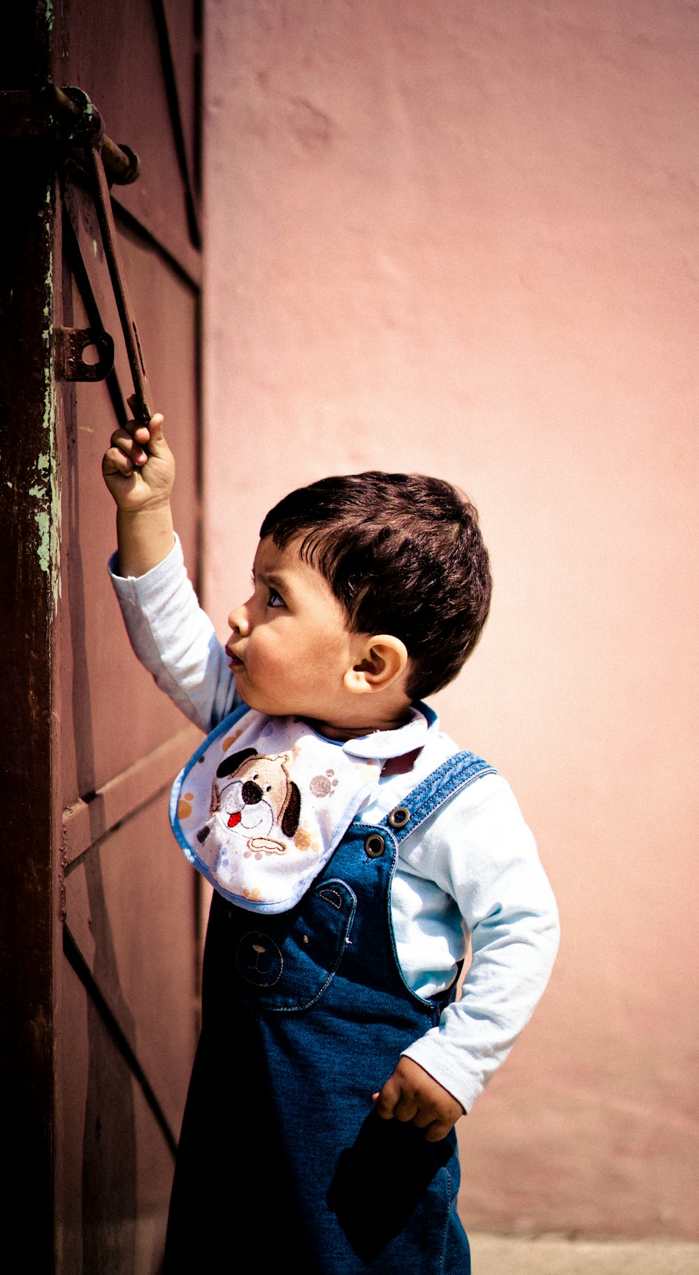 boy standing in front of the door