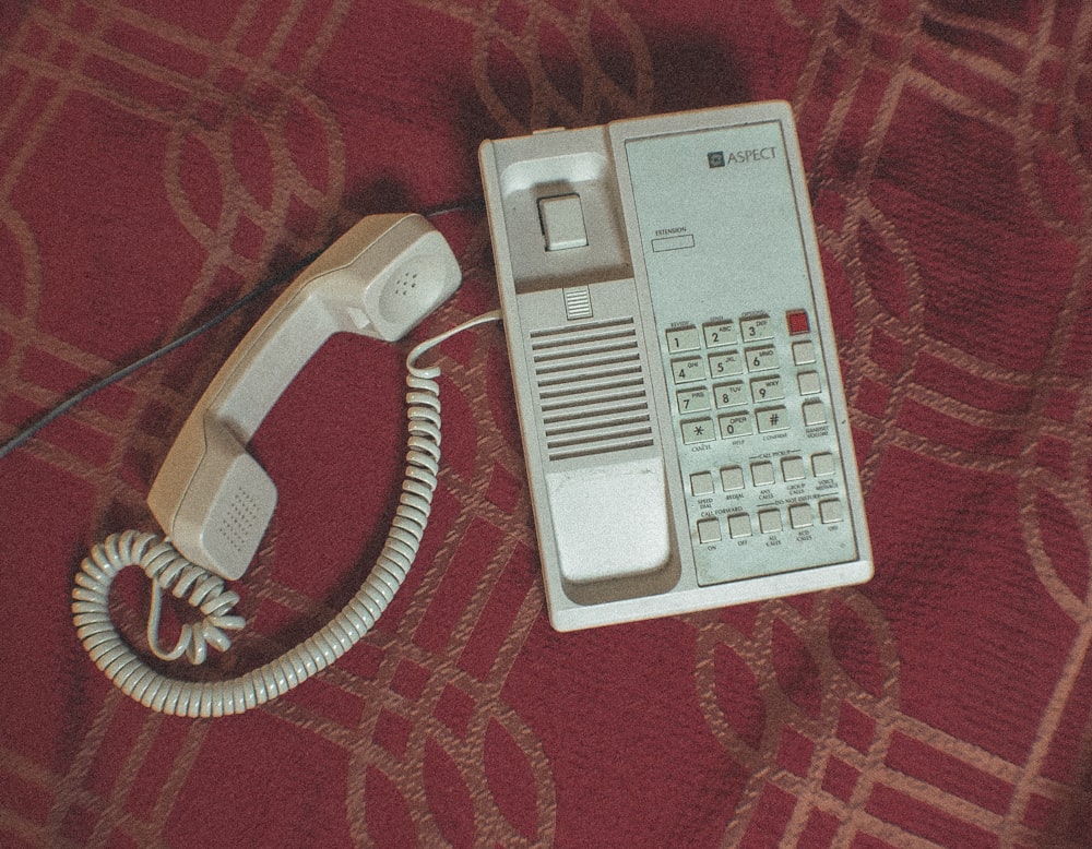 white corded home telephone