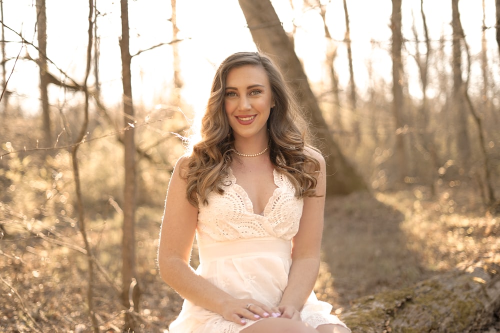 woman sitting near trees