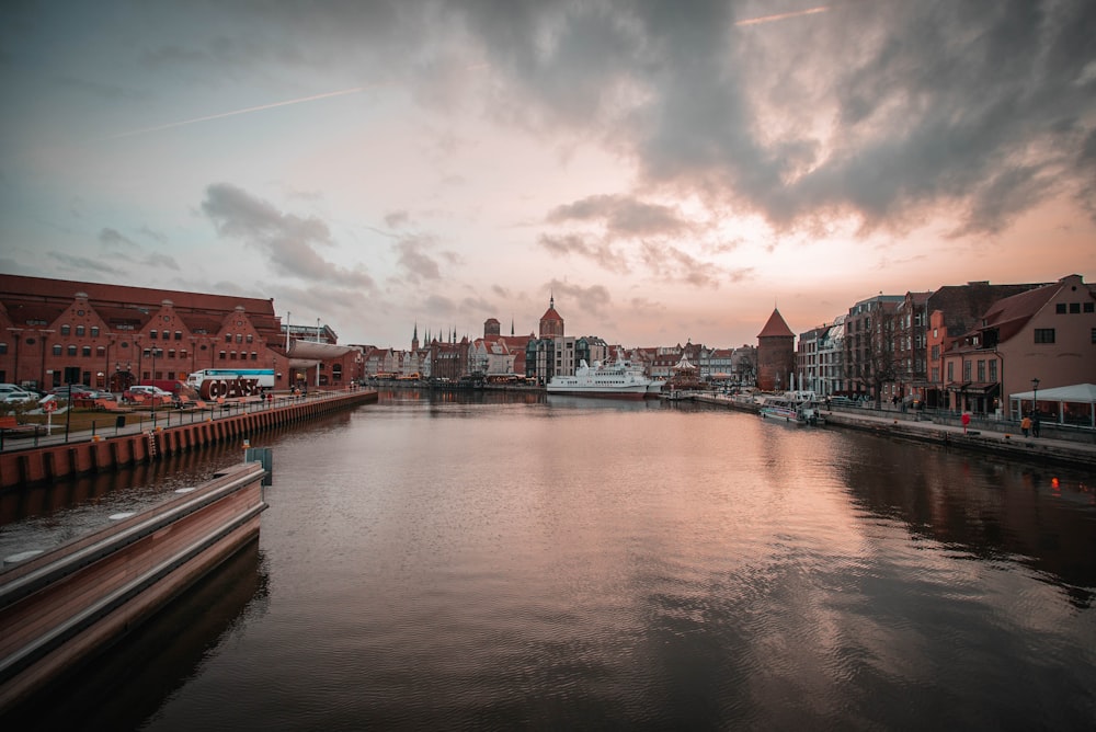 body of water across city building during daytime