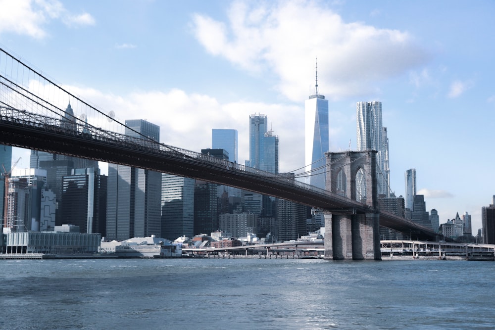 gray bridge across city building