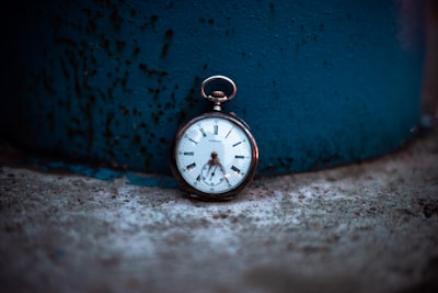 shallow focus photo of silver-colored pocket watch timeless google meet background