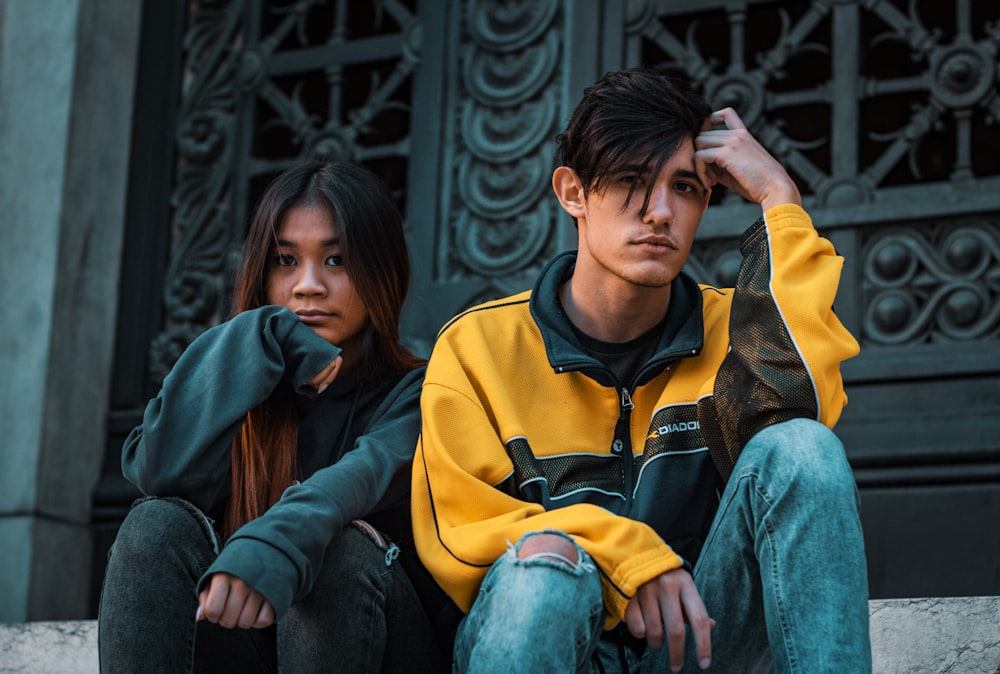 man and woman sitting near door