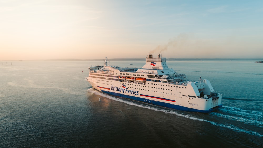 white and blue Brittany Ferries ferry sailing at the bay