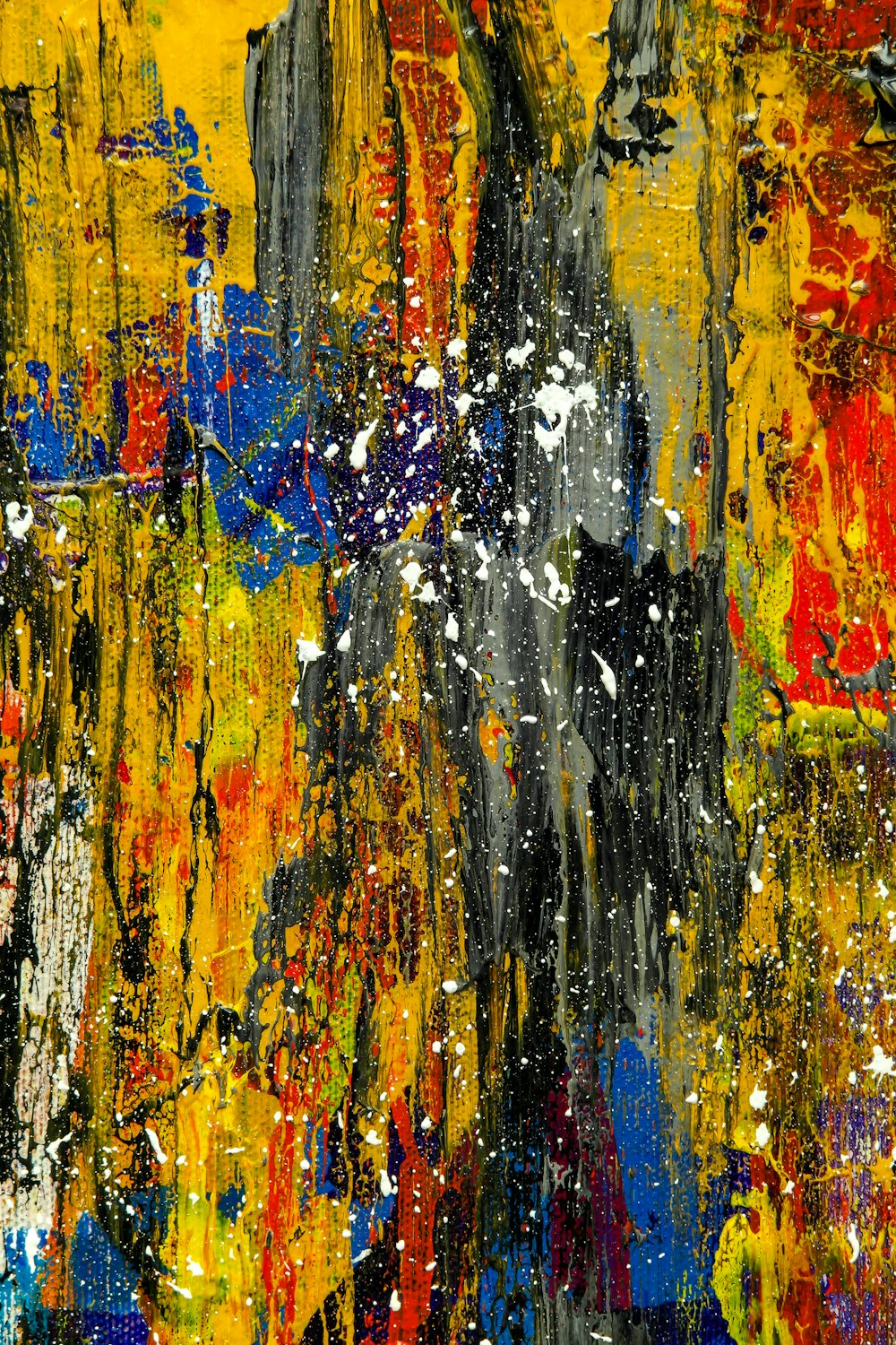 black, red, yellow, and white abstract painting