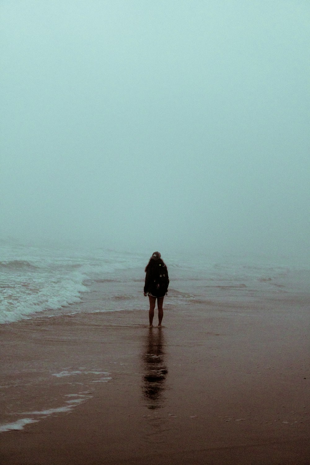 person standing on beach