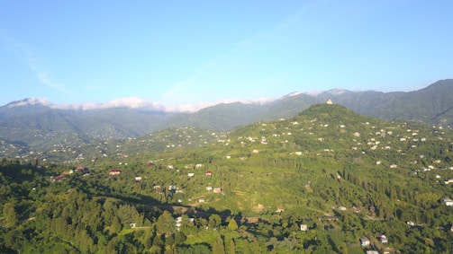 Bird's eye view of a newly completed property surrounded by lush greenery in Srivilliputhur.