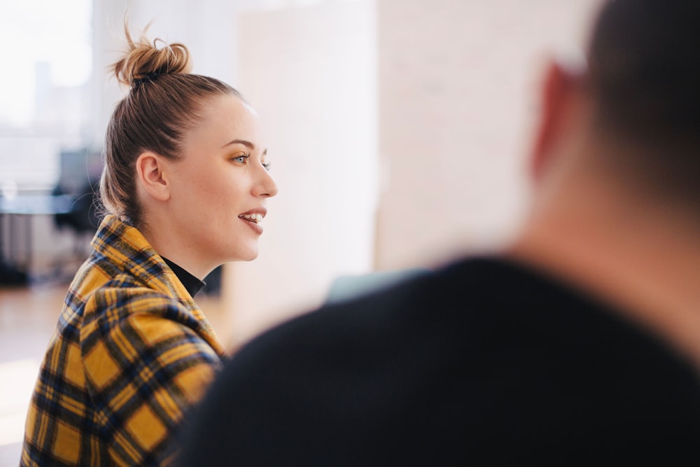 woman wearing yellow and black plaid shirt