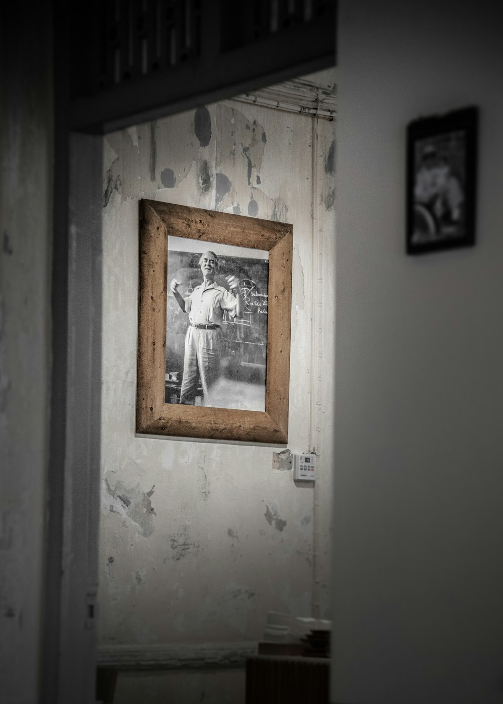 man in long-sleeved and pants framed photo on wall