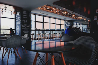 Cozy cafe interior with fresh branding elements and happy patrons enjoying coffee.