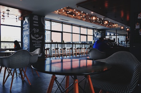 A cozy and modern cafeteria interior with customers enjoying their meals.