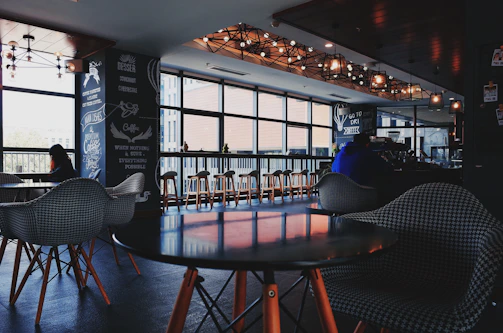 A cozy corner of Fans Cafe Ponorogo with warm lighting and modern decor.