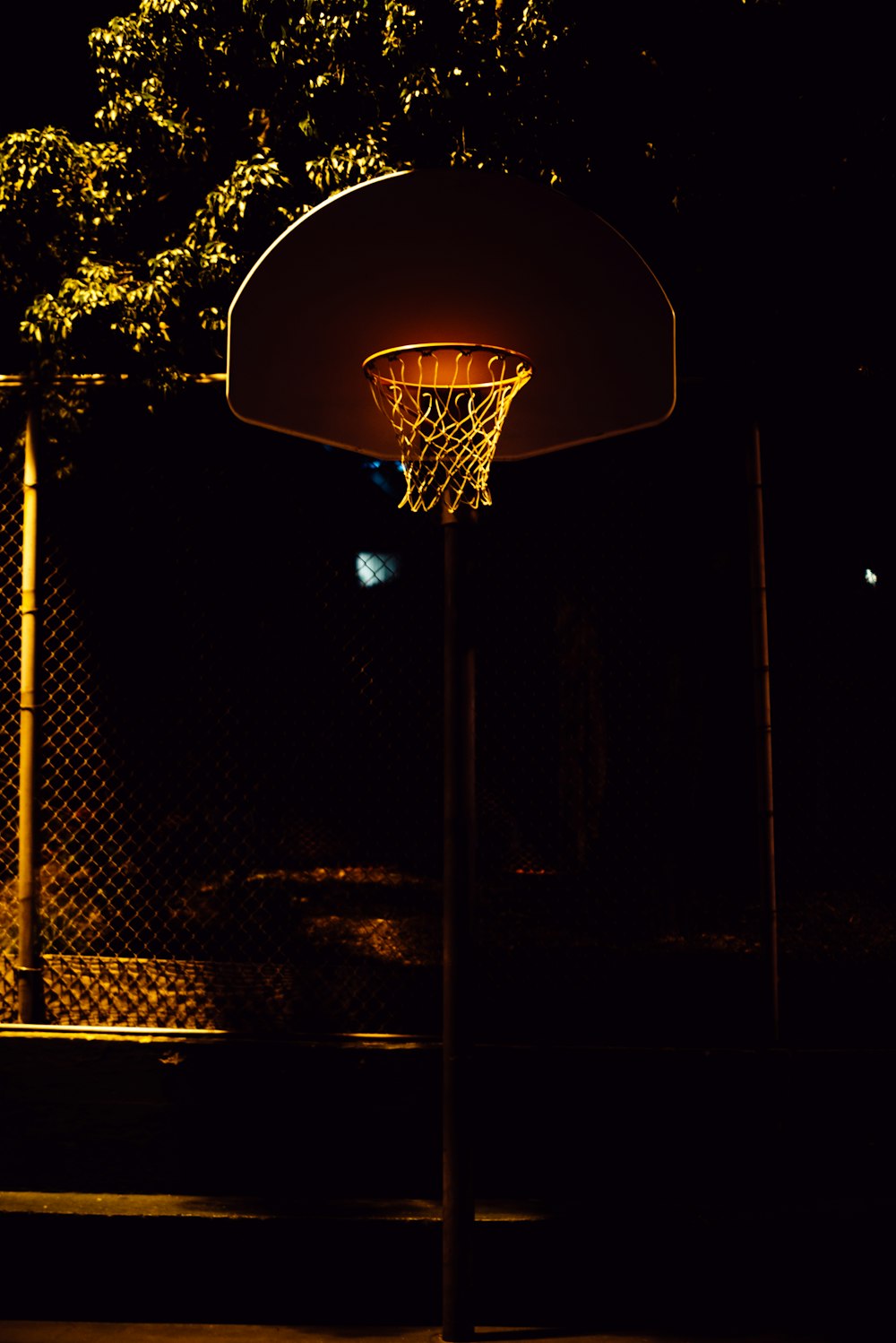 brown and white basketball hoop with net