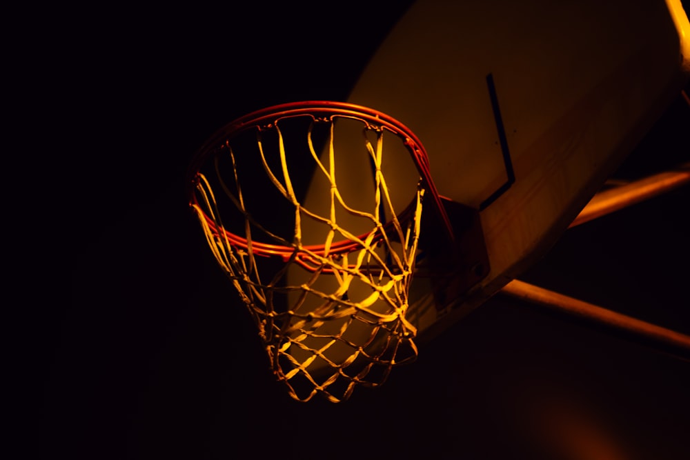 red and white basketball hoop with net