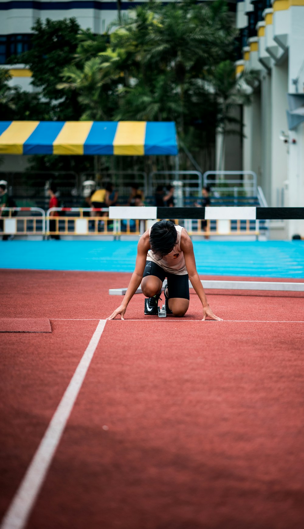 man kneeling aon ground