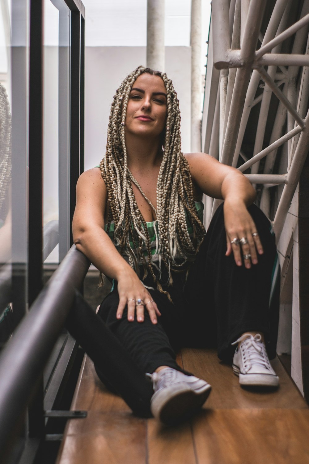 woman sitting on wooden floor