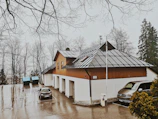 Solar PV carport installed over a mosque parking lot providing shade and clean energy.