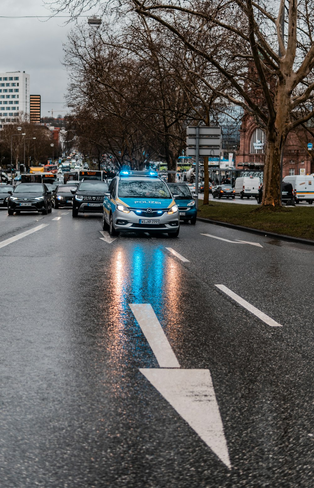 silver vehicle running on the road