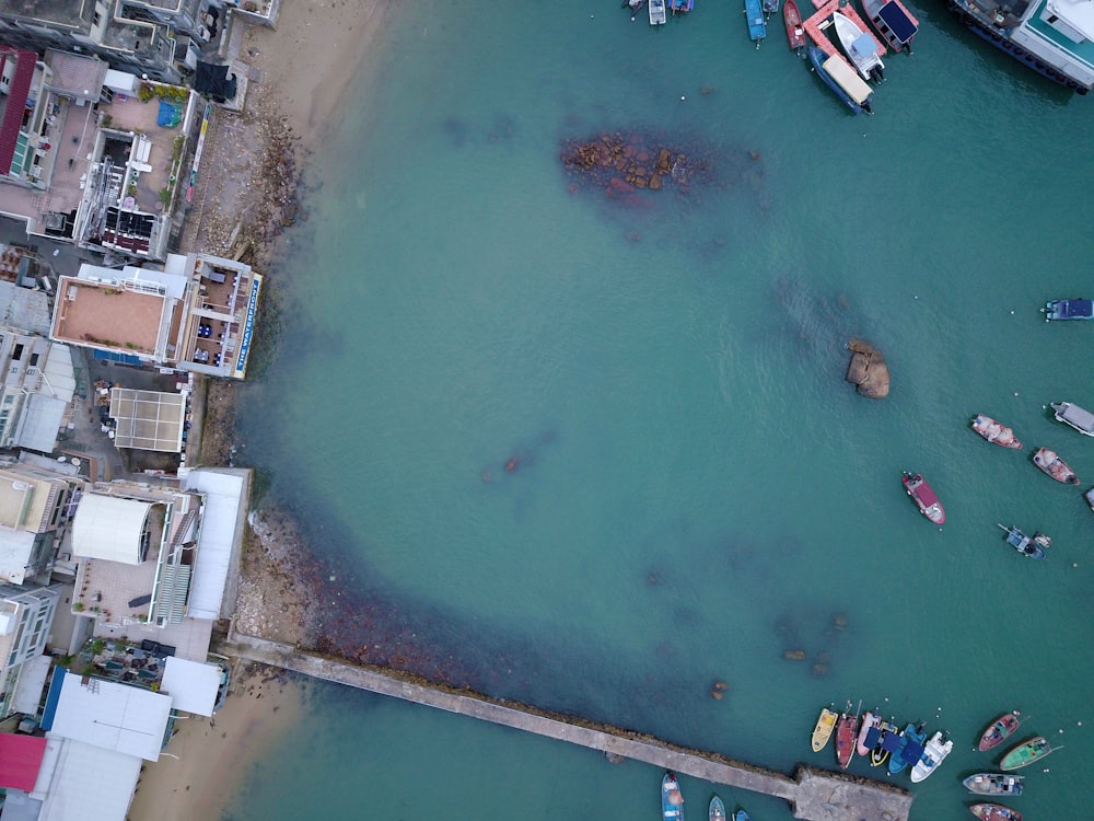 top-view photography of boat in body of water during daytime