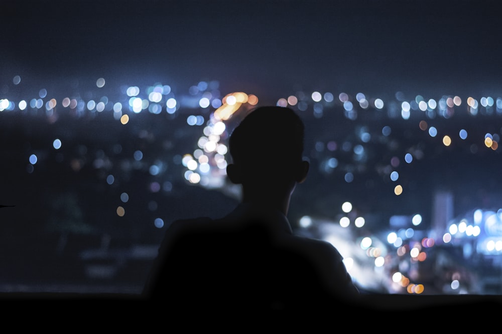 silhouette of person during night time