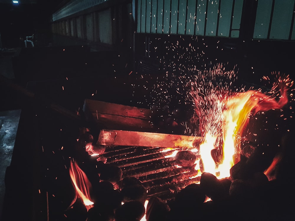 a person is cooking something on a grill