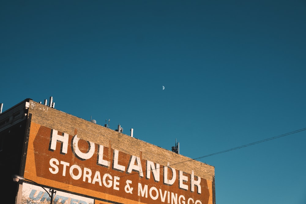 a building with a sign that reads holland storage and moving co