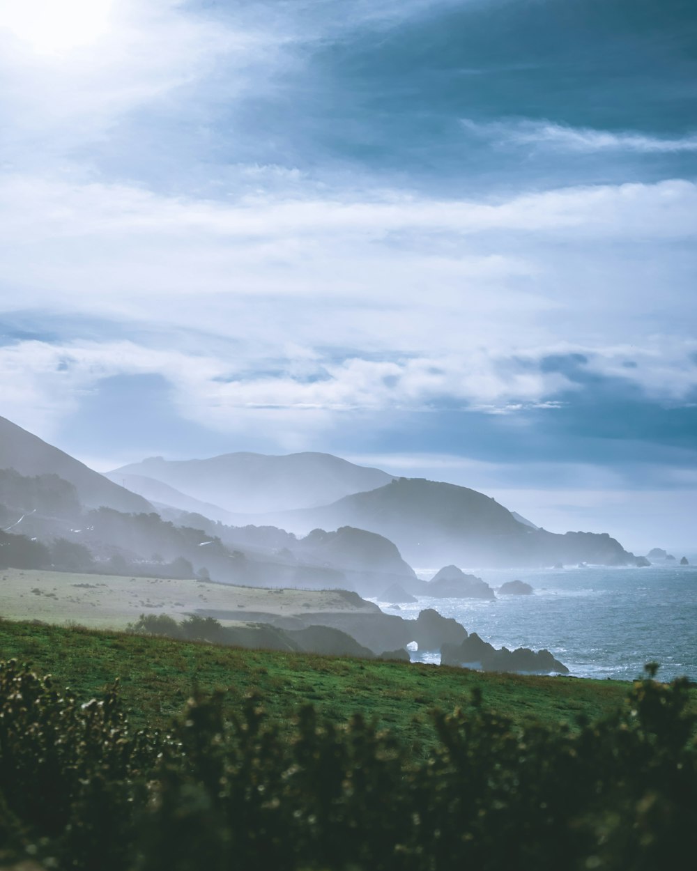 mountains beside calm water