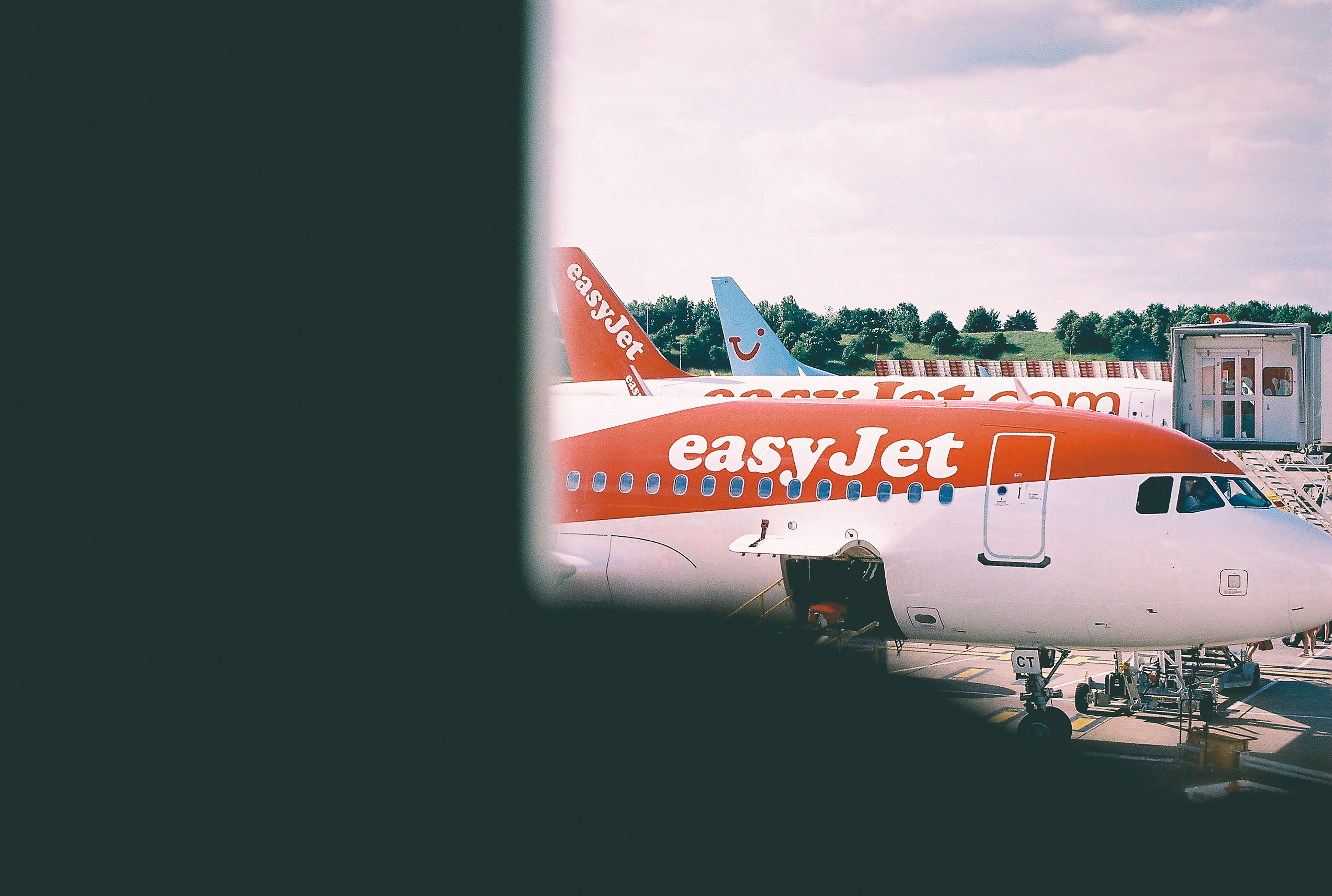 white and orange Easy Jet plane, London Film Airport