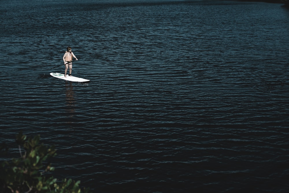 man riding boat at water