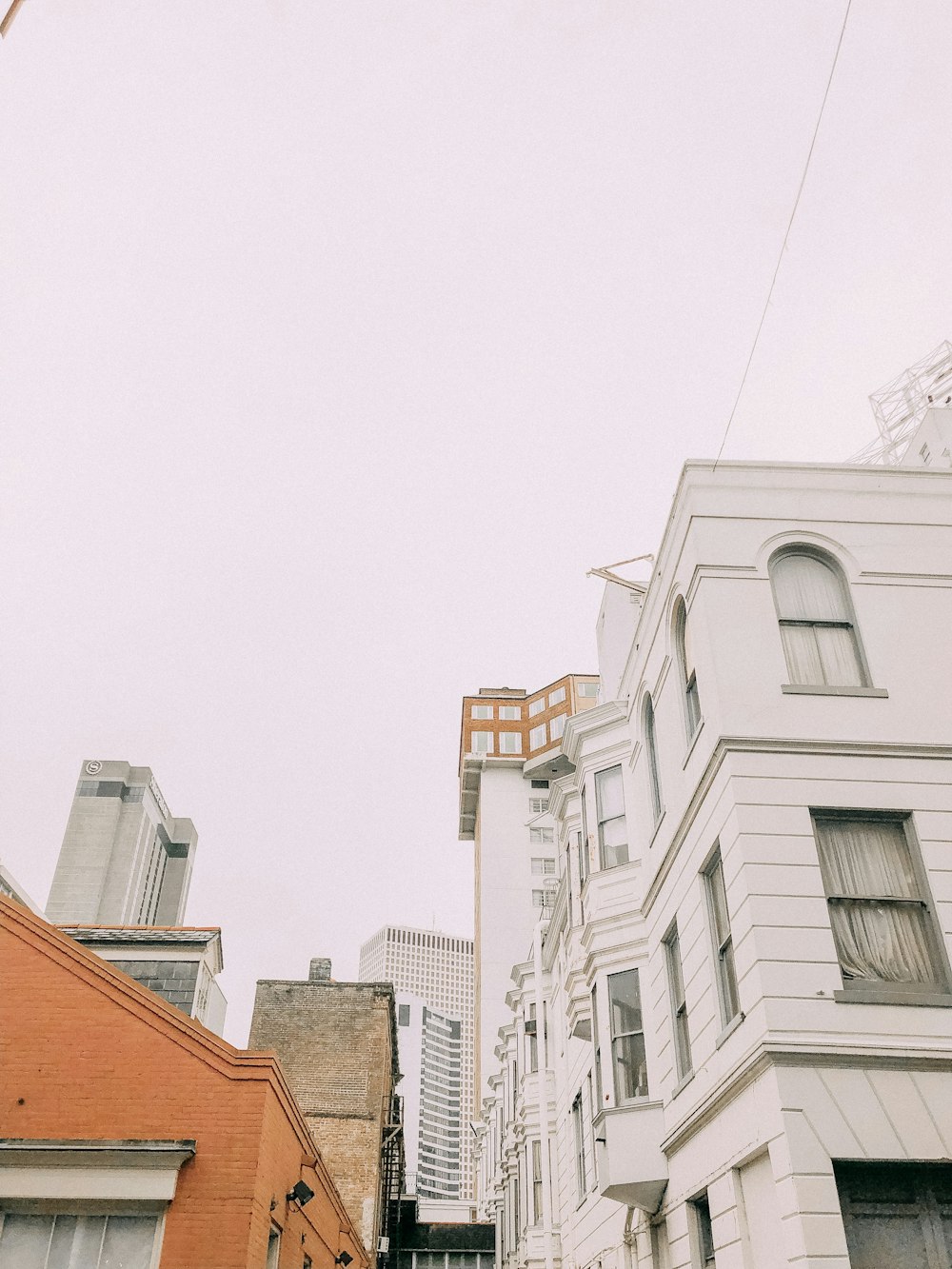 low-angle photograph of white buildings