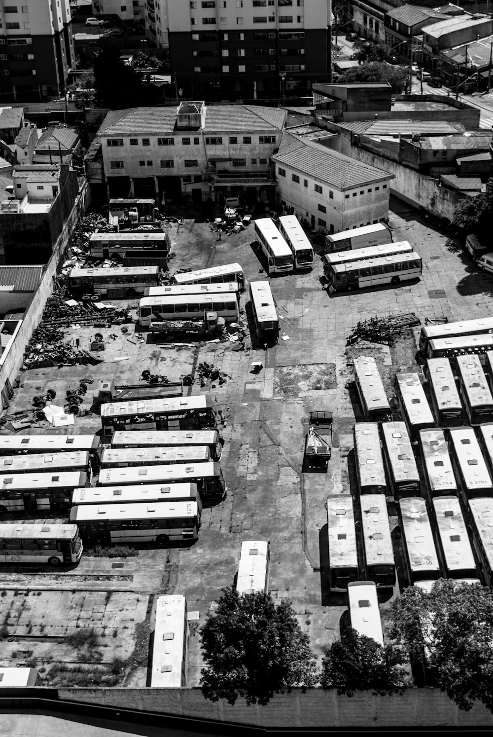 greyscale photo of aerial view of buses