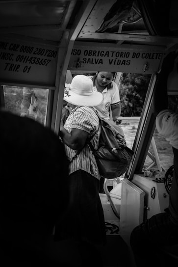 Friendly staff assisting a client at a vehicle dispatch office.