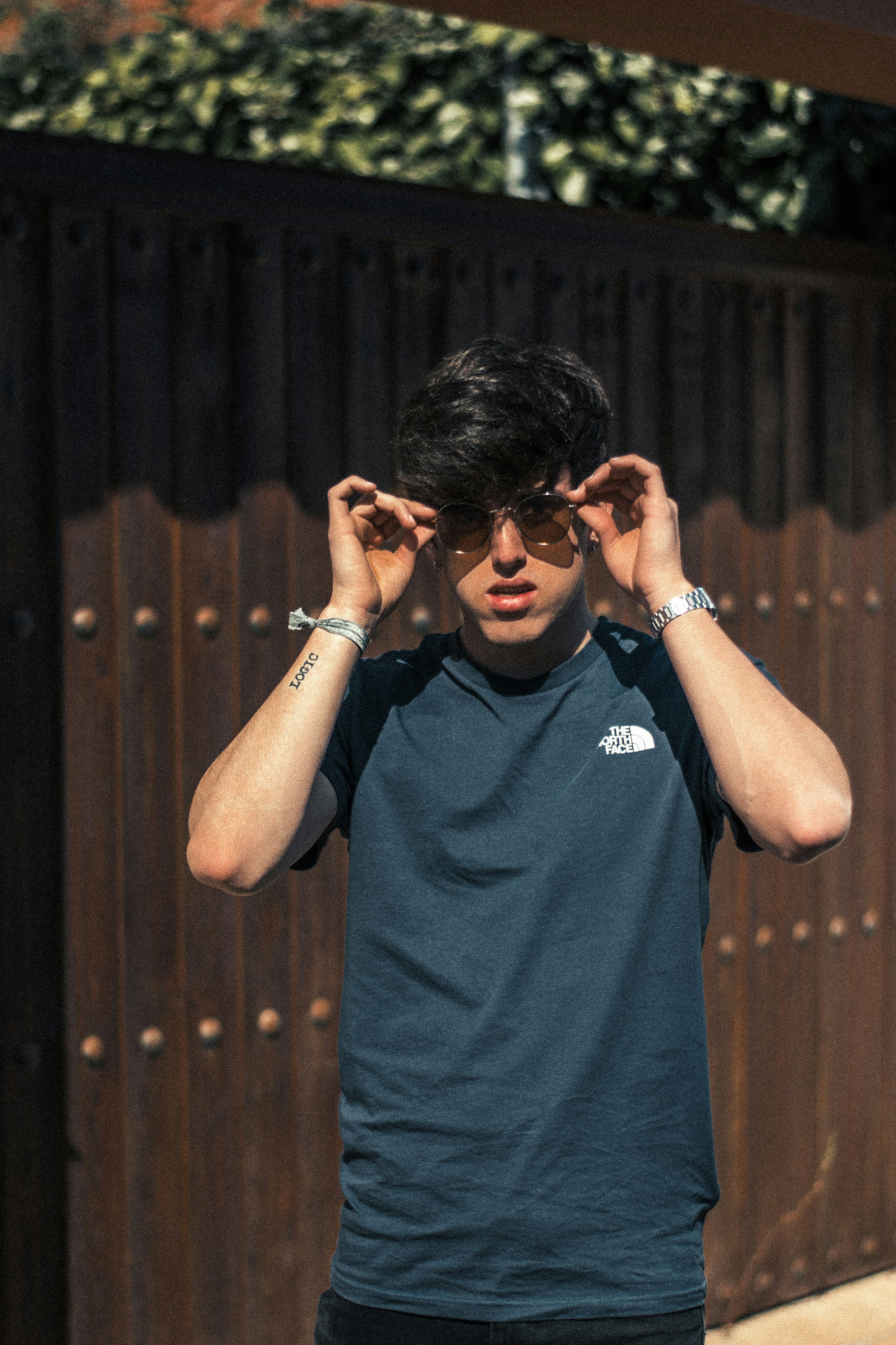 man in a green The North Face shirt